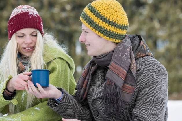 Young couple with coffee cup in snowy landscape in winter, Bavaria, Germany Germany CR_EDDR160117-02059-01 ,model released, Symbolfoto