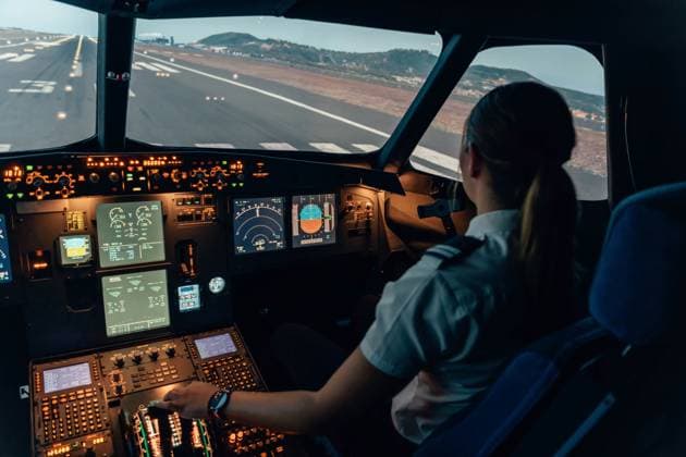 Female student pilot at the cockpit of an airliner Santa Cruz de Tenerife, Canary Islands, Spain CR_NSRZ231003-1263912-01 ,model released, Symbolfoto