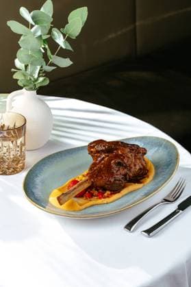 grilled leg of lamb with vegetables and sauce. restaurant menu R_KUAL231003-1252842-01