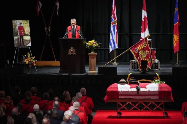 October 4, 2023, LANGLEY, BC, CANADA: Ridge Meadows RCMP Chaplain Greg Dalman speaks as RCMP Const. Rick O Brien s stetson rests on his casket during a regimental funeral in Langley, B.C., on Wednesday, October 4, 2023. O Brien, 51, was killed last month while executing a search warrant at a home in Coquitlam. LANGLEY CANADA - ZUMAc35_ 20231004_zaf_c35_093 Copyright: xDarrylxDyckx