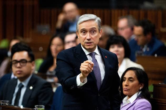 October 5, 2023, Ottawa, ON, Canada: Minister of Innovation, Science and Industry Franvßois-Philippe Champagne rises during Question Period on Parliament Hill in Ottawa, on Thursday, Oct. 5, 2023. Ottawa Canada  - ZUMAc35_ 20231005_zaf_c35_091 Copyright: xSpencerxColbyx