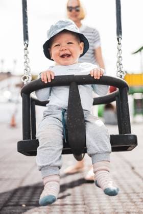Creative Highlights Symbolbilder Mother pushing her infant baby boy child on a swing on playground outdoors. Mother pushing her infant baby boy child on a swing on playground outdoors ,model released, Symbolfoto Copyright: xZoonar.com MatejxKastelicx 20515119 ,model released, Symbolfoto ,property released
