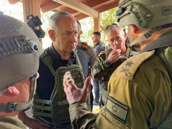 October 14, 2023, Israel: Israeli Prime Minister BENJAMIN NETANYAHU visits the Gaza border touring Kibbutz Beeri and Kibbutz Kfar Aza and viewed ruins of homes where massacres occurred. The Prime Minister met with IDF fighters in the field including Col. AMI BITTON, commanding officer of the Paratroopers 35th Brigade. Israel is engaged in a war with Hamas of the Gaza Strip following massive rocket fire from the Gaza Strip into Israel, infiltration of gunmen into Israeli territory, massacre of civilian women and children in their homes and hostage taking of civilians and soldiers. 300,000 reservists have been deployed and the Israeli AIr Force is massively bombing Gaza in preparation for the next stage of warfare. Israel - ZUMAi99_ 20231014_zip_i99_004 Copyright: xAvixOhayon IsraelxGpox