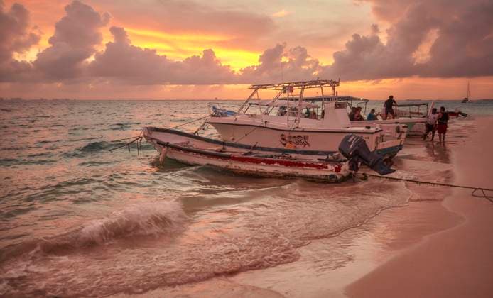 Boats moored on the shore of Isla Mujeres beach at sunset. Sunset & Boats Copyright: xFilippoxCarlotx COMM (3997)