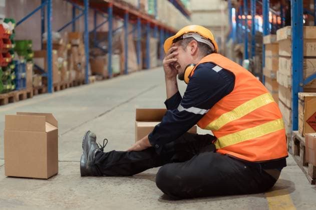 A warehouse employee was injured in an accident. because the product package fell from the shelves and crushed the employee s leg severely A warehouse employee was injured in an accident. because the product package fell from the shelves and crushed the employee s leg severely ,model released, Symbolfoto Copyright: xZoonar.com SunanxWongsa-ngax 20569892 ,model released, Symbolfoto ,property released