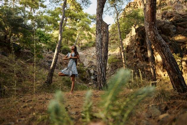 Teenage girl practicing tree pose yoga in forest model released, Symbolfoto, ANNF00540