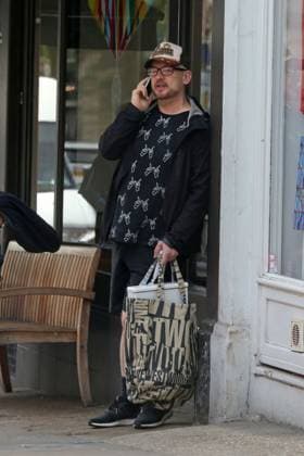 EXCLUSIVE: A dressed down Boy George was spotted having an animated chat on his mobile phone at Starbucks in Hampstead 138100, EXCLUSIVE: A dressed down Boy George was spotted having an animated chat on his mobile phone at Starbucks in Hampstead. The Culture Club singer, wearing a Whatever hand gesture printed shirt, recently revealed that Grammy winning singer Sam Smith was his new neighbor. London, United Kingdom - Tuesday June 2, 2015. UK, FRANCE, GERMANY, ITALY, MAILONLINE OUT, Credit:PacificCoastNews Avalon United Kingdom, London  Copyright: xPacificCoastNewsx xAvalonx 0519425581
