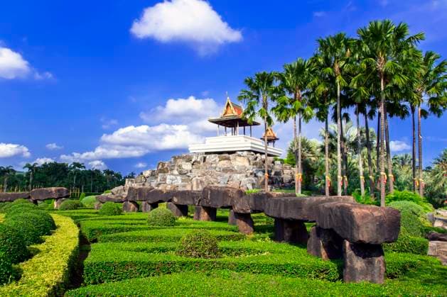 View to Pavillion and Stonehenge in Nong Nooch Garden. , 13438876.jpg, palm, tropical, nature, tree, asia, cultivated, plantation, woods, plant, view, scene, sunlight, bright, day, light, blue, sky, cloud, outdoor, pattaya, flora, branch, beauty, botanical, green, beautiful, park, thailand, summer, garden, Wat, Stone Henge, stonehedge, RECORD DATE NOT STATED