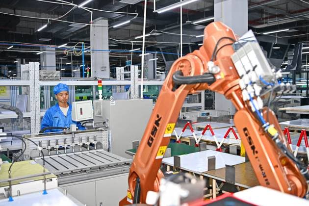 GANZHOU, CHINA - OCTOBER 28: An employee works on the production line of chip card products at a digital workshop of Shenzhen Einolda Smart-Card Mfg Co., Ltd. on October 28, 2023 in Ganzhou, Jiangxi Province of China.  Copyright: xVCGx 111461611736