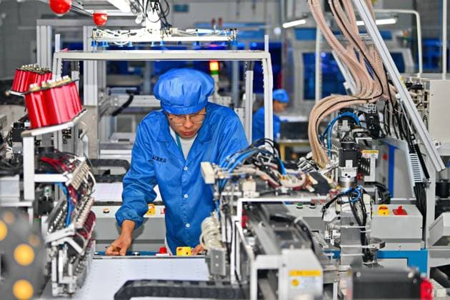 GANZHOU, CHINA - OCTOBER 28: An employee works on the production line of chip card products at a digital workshop of Shenzhen Einolda Smart-Card Mfg Co., Ltd. on October 28, 2023 in Ganzhou, Jiangxi Province of China.  Copyright: xVCGx 111461611740