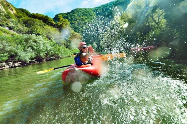 A male is looking back at camera and splahsing in red inflatable canoe having fun in calm waters of a river., model released, , 21025592.jpg, rafting, splash, splashing, canoe, playing, playful, vessel, team, sport, celebration, fun, excitement, laughing, river, calm, water, boat, action, exercise, man, male, happy, health, holiday, joy, nature, outdoor, people, person, spring, summer, together, travel, vacation, young, RECORD DATE NOT STATED