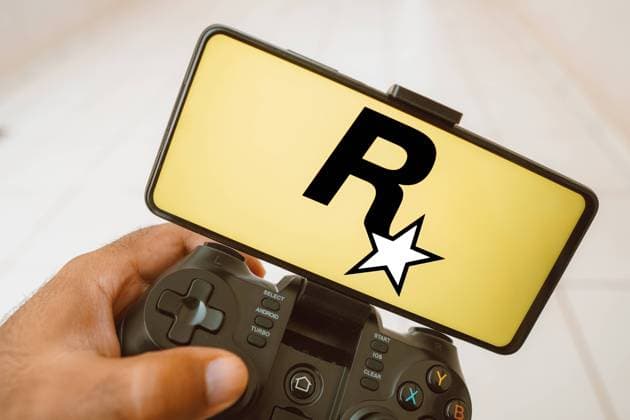 August 11, 2023, Brazil. In this photo illustration, a person plays on a joystick and the Rockstar Games logo displayed on a smartphone screen. August 11, 2023, Brazil. In this photo illustration, a person plays on a joystick and the Rockstar Games logo displayed on a smartphone screen Copyright: xZoonar.com rafapressx 20618941