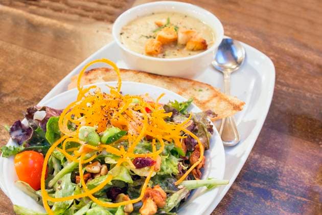 Spring Green Salad with Edamame Tomato Cashews Cranberries and Bowl of Corn Chowder Soup Closeup Copyright: JitxLim 32266422