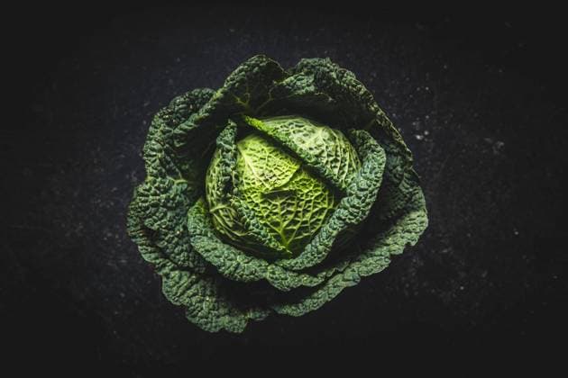 Green savoy cabbage Green savoy cabbage on black table. Top view. Copyright: xZoonar.com JIRIxHERAx 17051281