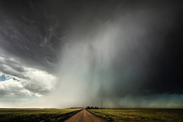 Rural landscape with dramatic sky Country scene in USA with dark stormy sky over road track disappearing into distance America Copyright: xJodyxMillerx jmil-45773