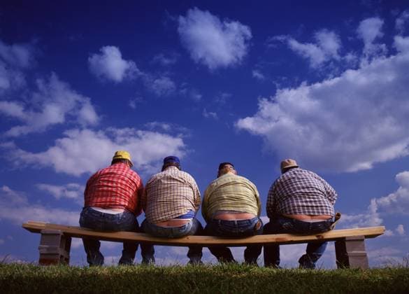 Lunch Break II Four construction workers expose their rear ends while leaning over on a bench to eat lunch USA No model release Copyright: xJimmyxWilliamsx jwil23308