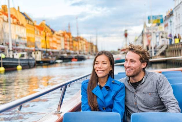 Copenhagen tourists people on Denmark travel holiday cruise boat tour in old port. Young multiracial couple travelers relaxing enjoying view of Nyhavn danish destination in Europe, fall or spring., model released, , 33003360.jpg, copenhagen, denmark, travel, tourists, europe, people, boat, cruise, nyhavn, couple, city, tourism, tourist, woman, man, tour, spring, autumn, happy, european, water, men, asian, interracial, guided, lifestyle, view, enjoying, sitting, fall, northern, scandinavian, young, chinese, holidays, vacations, vacation, girl, canal, kobenhavn, danmark, danish, person, holiday, old, houses, colors, colorful, scandinavia, multiracial RECORD DATE NOT STATED