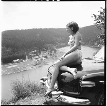 Archivbilder der Woche KW46 ***JULY 28, 1966 FILE PHOTO***Girl is sitting on the Car Tatra 603 near Vranovska Dam, Czechoslovakia, July 28, 1966. (CTKxPhoto EmilxBican) CTKPhotoF202005141424801  CTKPhotoF202005141424801