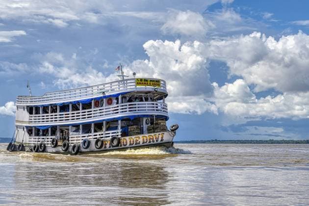 Traditional wooden boat navigating on the Rio Negro, Manaus, Amazonia State, Brazil, South America Copyright: G&MxTherin-Weise 1131-1919