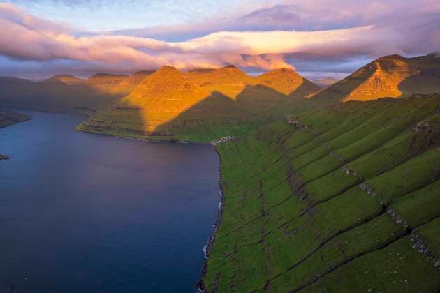 Aerial shot of the dramatic view of Funningur with pink sky at dawn, Eysturoy island, Faroe islands, Denmark, Europe Copyright: PaoloxGraziosi 1361-274 RECORD DATE NOT STATED