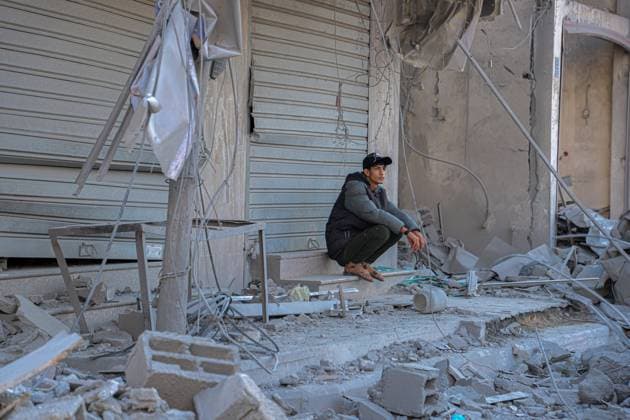 (231118) -- GAZA, Nov. 18, 2023 -- A man is seen among the rubble of buildings destroyed in Israeli military operations in the southern Gaza Strip city of Khan Younis Nov. 17, 2023. Gaza s government media office announced on Friday that the total number of Palestinian deaths in the enclave has exceeded 12,000 since the start of the Israel-Hamas conflict on Oct. 7. (Photo by Xinhua) MIDEAST-GAZA-PALESTINIAN-ISRAELI CONFLICT RizekxAbdeljawad 