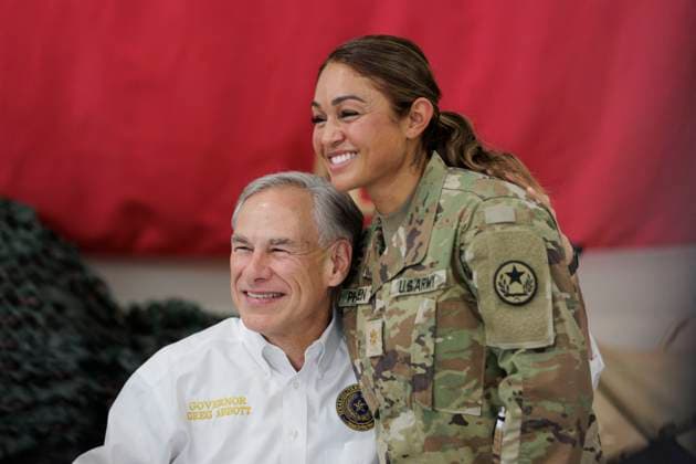 November 19, 2023, Edinburg, Texas, United States: Texas Governor GREG ABBOTT poses with a service member in the Texas National Guard at the South Texas International airport on November 19, 2023 in Edinburg, Texas. Former President Trump and Abbott served meals to Texas National Guard and Texas Department of Public Safety (DPS) troopers that are stationed at the U.S.-Mexico border over the Thanksgiving holiday.Phobo by Pool Edinburg United States - ZUMAz113 20231119_znh_z113_026 Copyright: xMichaelxGonzalezx