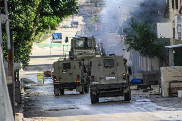 November 21, 2023, Nablus, Palestine: Israeli military reinforcements storm Balata refugee camp during a raid to arrest wanted Palestinians, east of Nablus in the northern West Bank. Nablus Palestine - ZUMAs197 20231121_aaa_s197_095 Copyright: xNasserxIshtayehx