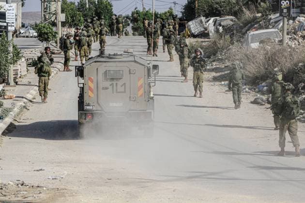 November 23, 2023, Nablus, West Bank, Palestine: Israeli soldiers on foot storm the Balata refugee camp during a large-scale raid in the Balata refugee camp to arrest wanted Palestinians east of Nablus in the northern West Bank. Nablus Palestine - ZUMAs197 20231123_aaa_s197_195 Copyright: xNasserxIshtayehx