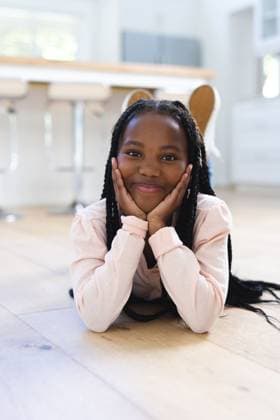 Happy african american girl lying on floor with hands on face at home, copy space Happy african american girl lying on floor with hands on face at home, copy space. Childhood, expression, gesticulation and domestic life, unaltered., model released, , property released, Cape Town, South Africa, 17.10.2023, 4912956.jpg, people,happy,african american,girl,lying,floor,hand,face,home,copy space,childhood,expression,gesticulation,domestic life,unaltered,kid,young,portrait,cute,person,smile,little,cheerful,fun,happiness,lifestyle,adult,attractive,room,pretty,joy,family,smiling,house,african,american,copy,space,domestic,life Child,Girl,Female,Black