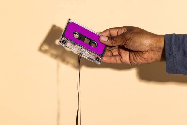 Creative Highlights Symbolbilder Close up of hand of african american man holding purple cassette tape over beige background Close up of hand of african american man holding purple cassette tape over beige background. Music, sound, listening, entertainment and nostalgia concept., model released, , property released, Cape Town, South Africa, 2023-10-30T22:00:00.000Z, 4920782.jpg, people,close,hand,african american,man,holding,purple,cassette tape,beige background,music,sound,listening,entertainment,nostalgia,concept,audio,musical,concert,noise on tape,musician,person,technology,song,business,play,design,tverror,background,performance,instrument,documentary,closeup,melody,archival,headphones,african,american,cassette,tape,beige Mid Adult,Man,Male,Multiracial