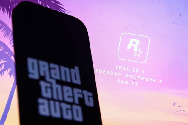Rockstar Grand Theft Auto Announcement Photo Illustrations Rockstar website announcing GTA 6 trailer displayed on a laptop screen and Grand Theft Auto logo displayed on a phone screen are seen in this illustration photo taken in Krakow, Poland on December 3, 2023. Krakow Poland  Copyright: xJakubxPorzyckix originalFilename: porzycki-rockstar231203_npbL5.jpg