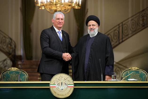 December 4, 2023, Tehran, Iran: Iranian President EBRAHIM RAISI (R) and his Cuban counterpart MIGUEL DIAZ-CANEL (L) attending a joint press conference at the presidential palace in Tehran. Tehran Iran - ZUMAi98_ 20231204_zih_i98_016 Copyright: xIranianxPresidencyx