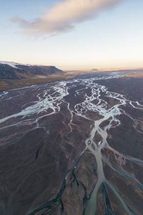 Creative Highlights World An aerial shot captures the intricate patterns of braided rivers winding through Thorsmork s vast and rugged landscapes at twilight. Model Released JuanLopez_ID17496_530789_016 Copyright: xJuanxLopezx RECORD DATE NOT STATED