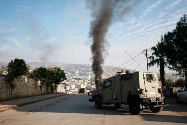 A convoy of Israeli army vehicles is seen during a military raid into Faraa refugee camp A convoy of Israeli army vehicles is seen during a military raid into Faraa refugee camp, West Bank, Friday, Dec. 8, 2023. The Palestinian Health Ministry says that five Palestinians were killed when Israeli forces raided the camp prompting fighting with local militants. Photo by Mohammed Nasser apaimages Faraa Camp West Bank Palestinian Territory 081223_Farah_Camp_MN_00(11) Copyright: xapaimagesxMohammedxNasserx xapaimagesx
