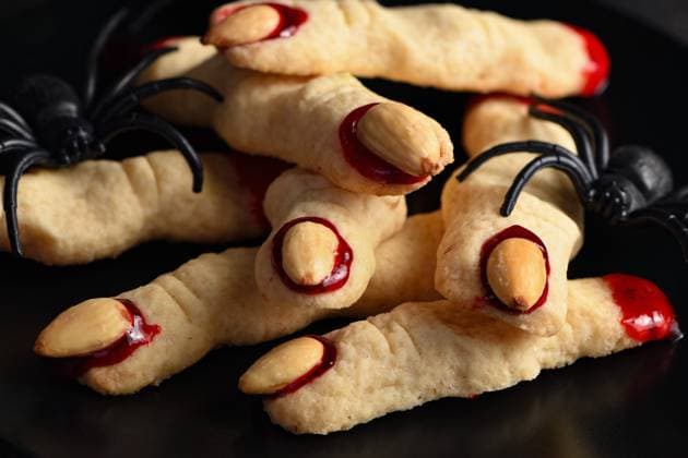 Creepy, scary Halloween Witch fingers Creepy, scary Witch fingers made from sugar cookies with raspberry jam and almonds on Halloween. Trick-or-treat. Classic Cookie Witch Fingers takes on a healthy, gluten-free, paleo, vegan look. Copyright: xZoonar.com MarynaxVoronovax 20683068