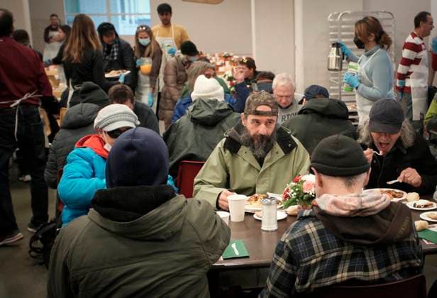 (231210) -- VANCOUVER, Dec. 10, 2023 -- People enjoy meals during the annual Christmas dinner at Union Gospel Mission (UGM) in Vancouver, British Columbia, Canada, on Dec. 9, 2023. (Photo by Xinhua) CANADA-VANCOUVER-CHRISTMAS-CHARITY DINNER LiangxSen 