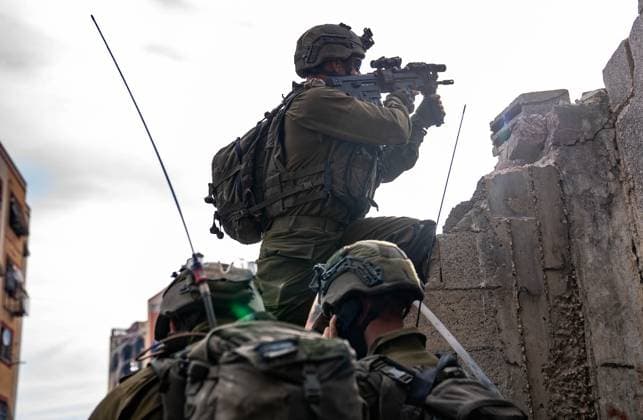 (231211) -- BEIJING, Dec. 11, 2023 () -- This photo released by the Israel Defense Forces (IDF) on Dec. 10, 2023 shows Israeli troops conducting military operations in the Gaza Strip. () PHOTOS OF THE DAY Xinhua 