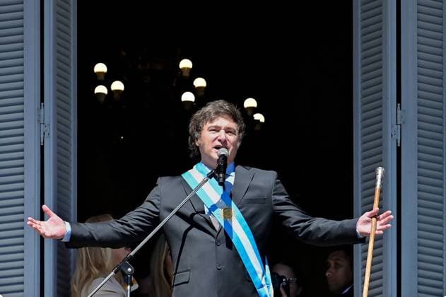 (231211) -- BUENOS AIRES, Dec. 11, 2023 -- Argentina s new President Javier Milei delivers a speech to the crowd at a balcony of the Casa Rosada Presidential Palace in Buenos Aires, Argentina, Dec. 10, 2023. Javier Milei, a liberal politician and economist, assumed the Argentine presidency Sunday in a ceremony held at the National Congress in Buenos Aires, the country s capital. The outgoing head of state, Alberto Fernandez, placed the presidential sash and handed the baton of command to Milei, whose term will last for four years, until Dec. 10, 2027. (Photo by Xinhua) ARGENTINA-BUENOS AIRES-JAVIER MILEI-INAUGURATION GermanxAdrasti 