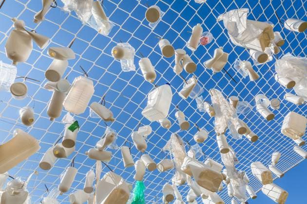 Plastic containers in fishing net against blue sky - concept of garbage Plastic containers in fishing net against blue sky - concept of garbage, water pollution, environmental issue Copyright: xZoonar.com IngridxBalabanovax 20731967