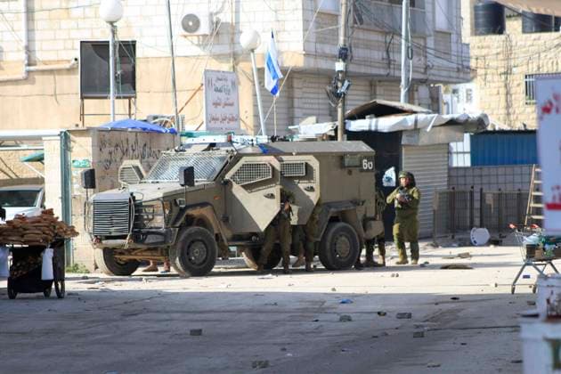 Israeli military vehicles enter the Jenin refugee camp in the occupied West Bank Israeli military vehicles enter the Jenin refugee camp in the occupied West Bank during a raid on December 12, 2023. Israeli forces killed four Palestinians in Jenin on December 12, the Palestinian health ministry reported without further details on the fatalities, while the Palestinian Red Crescent Society said they were killed in a drone strike in the old town. Photo by Mohammed Nasser apaimages Jenin West Bank Palestinian Territory 121223_Jenin_MN_00(5) Copyright: xapaimagesxMohammedxNasserx xapaimagesx