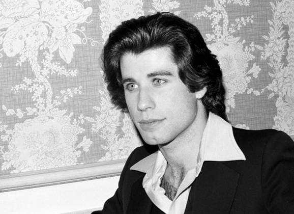 John Travolta at a press conference for Saturday Night Fever, 1977. (File Reference 34580-505THA)  Copyright: xCinemaxLegacyxCollection ThexHollywoodxArchivex 34580-505THA The Hollywood Archive