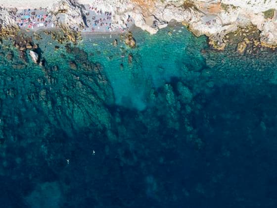 An aerial view of the azure blue sea by the rocky shores of Nice, capturing the natural beauty of the CÃ te d Azur. Model Released JuanAizpuru_ID18089_544081_005 Copyright: xJuanxAizpurux