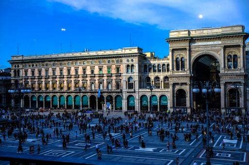 A wide shot of people walking near Galleria Vittorio Emanuele II shopping mall in Milan, Italy 26668 RECORD DATE NOT STATED