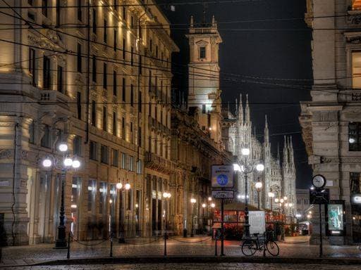 A horizontal shot of beautiful Italian apartment buildings with street lights at night time in Milan, Italy 67757 RECORD DATE NOT STATED