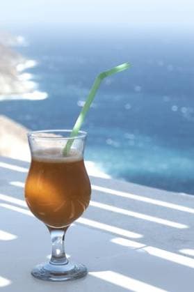 A vertical shot of a glass of fresh refreshing orange juice in the Greek island of Folegandros 149290 RECORD DATE NOT STATED
