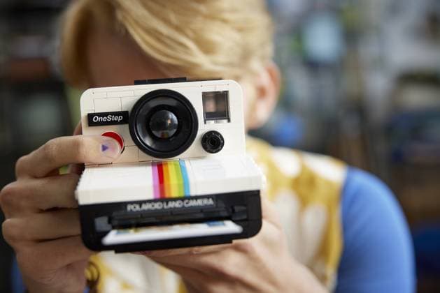 The LEGO Group and Polaroid have unveiled their LEGO IDEAS: Polaroid OneStep SX-70 Camera. Conceived by LEGO fan Marc, known as Minibrick Productions (@minibrickYT), this collaboration brings Polaroid s iconic camera to life in the form of LEGO bricks. Scheduled for launch on 1 January, 2024, the LEGO polaroid marks the 53rd product from the fan-sourced platform. Comprising 516 pieces, the model faithfully captures the design features that made the original OneStep Camera a favourite. The unique display model incorporates functional elements, including a working viewfinder, the iconic Color Spectrum, an exposure compensation dial, and a shutter button. The set also includes a buildable Polaroid Time-Zero Land Film pack and three LEGO Polar Copyright: xx 53313197