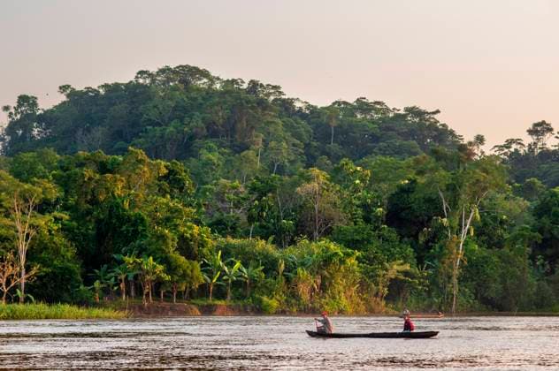 Wooden small boat sailing with local people on Purus river in Amazon on sunny summer day with trees on river bank, near Iquitos, Loreto, Peru. Navigating one of the tributaries of the Amazon to Iquitos about 40 kilometers near the town of Indiana. Belen Peru Copyright: xSergixReboredox xVWPicsx SRE-BJ0906