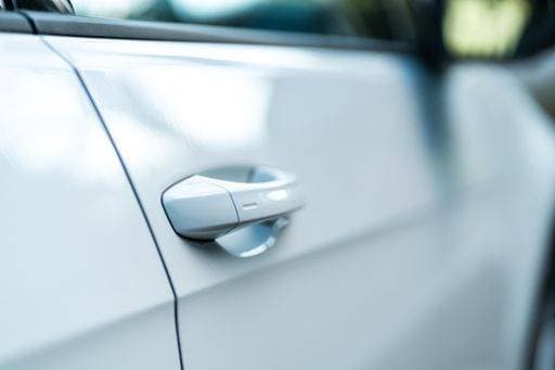 Closeup of a bright car door. Concept for a modern car. Perfect to illustrate new mobility, car purchase or electric vehicles. 366010 RECORD DATE NOT STATED