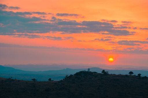 A breathtaking view of the sunset over the tree covered mountains in Kenya, Nairobi, Samburu 89413 RECORD DATE NOT STATED