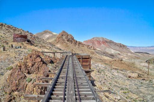 RECORD DATE NOT STATED Tracks once used by ore carts cross an abandoned trestle at the gold mining ghost town of Nivloc, Nevada. 481456